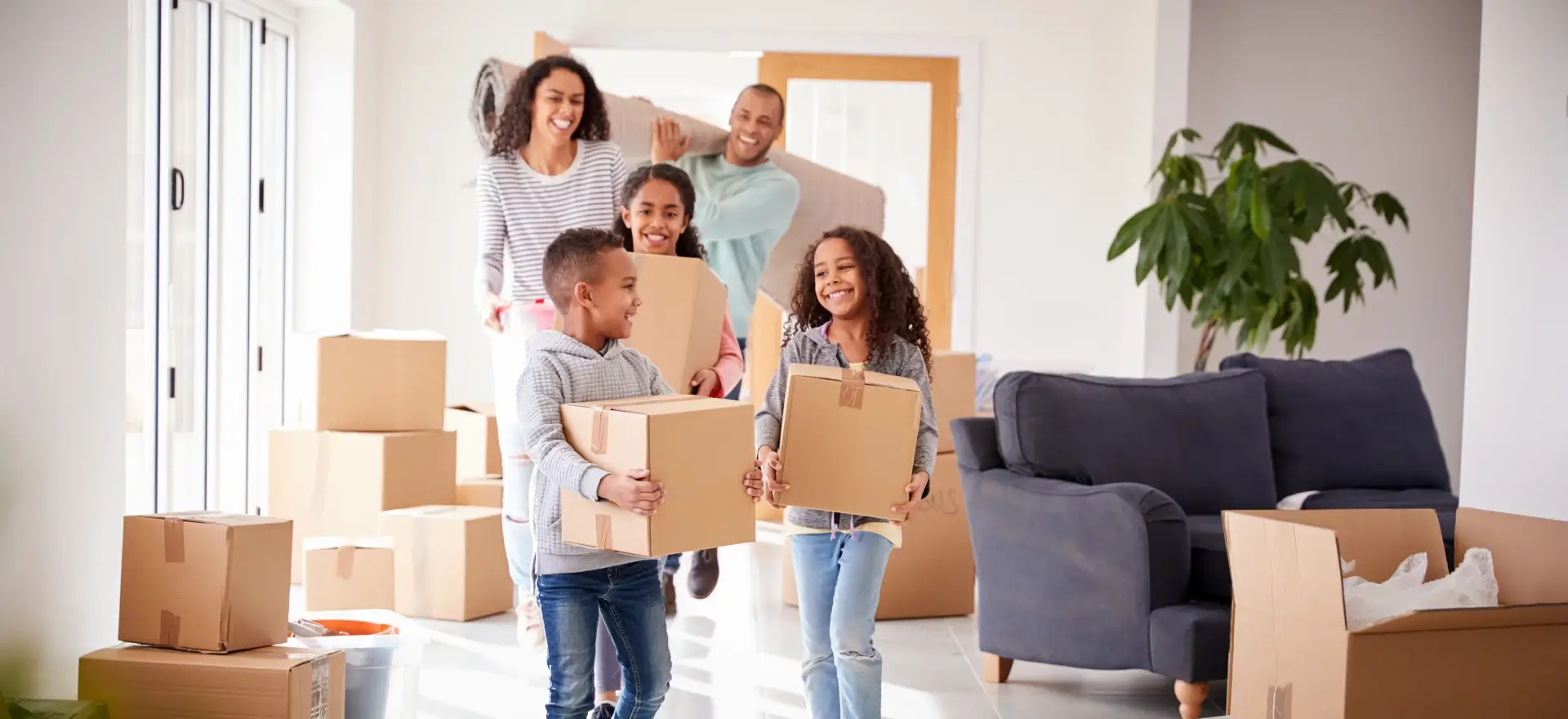 Happy family moving in to their new home thanks to Duane Buziak Mortgage Broker